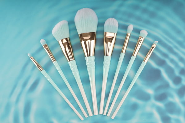 Private label makeup brushes being assembled in a factory